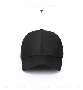 Detail of black breathable mesh baseball cap with triangle metal badge and stitch work