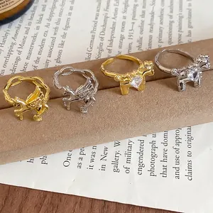 Adjustable gold and silver horse rings set with cubic zirconia and pegasus wings design