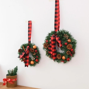 Christmas wreath set with pine cones berries and red plaid ribbon for home wall decoration