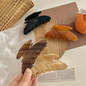 Brown tortoiseshell large acetate hair claws set including amber and black shark hair clips