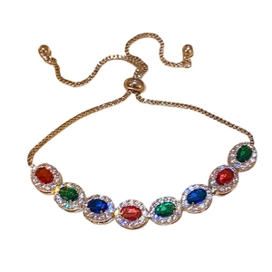 Bracelet vintage doré avec pierres ovales colorées et entourage de zircons blancs