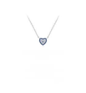 Macro shot of silver heart pendant with blue gemstone outer ring and diamond inner circle