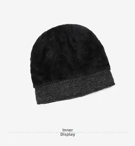 Detailed view of the thick black fleece lining inside the grey winter knitted beanie hat