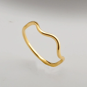 Elegant gold wavy stackable ring with a minimalist curved design for modern style