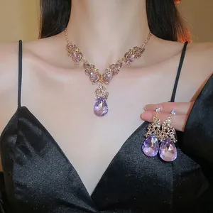 Luxurious purple teardrop crystal jewelry set with necklace and matching earrings