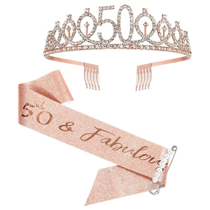 Rose gold 50th birthday set featuring a rhinestone tiara, glitter sash, and pearl pin