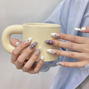 Handmade Y2K purple glitter press-on nails with silver 3D stars and metallic accents