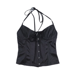Detail of black corset halter top featuring front hook-and-eye closure and lace-up neck
