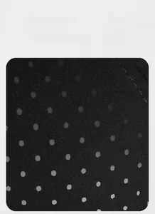Macro detail of breathable black mesh fabric with round ventilation holes for a hip-hop hat