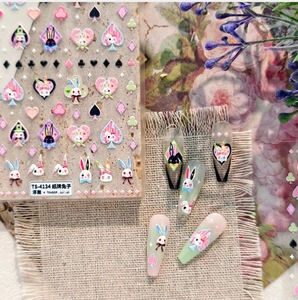 Detail of 3D embossed rabbit nail art stickers with poker hearts and spades patterns
