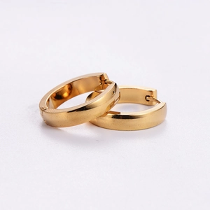 Polished gold stainless steel huggie hoop earrings with minimalist mirror finish