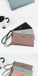 Detailed view of large capacity faux leather wallets in diverse colors with zip closures
