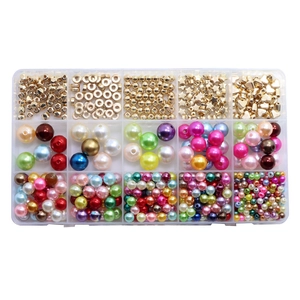 15-compartment box with assorted DIY jewelry beads including colorful pearls and gold stars