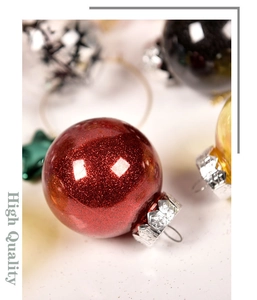 Close-up of a 6cm red glitter Christmas ornament with festive bokeh background