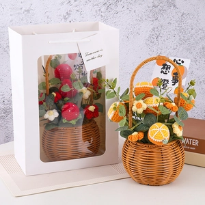 Handmade crochet fruit basket gift set with strawberry and orange designs in a gift bag