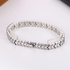 Detailed macro view of 10mm stainless steel V-link chain bracelet with a secure press clasp