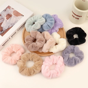 Colorful fluffy plush scrunchies set in soft pastel tones for women hair styling
