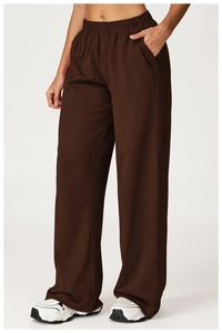 Detail view of dark brown high-waisted wide leg sweatpants with elastic waistband