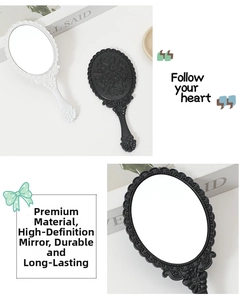 Detail of European vintage embossed patterns on white and black handheld mirrors