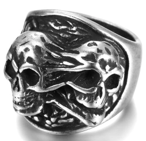 Macro detail of retro gothic double skull ring in vintage silver stainless steel finish