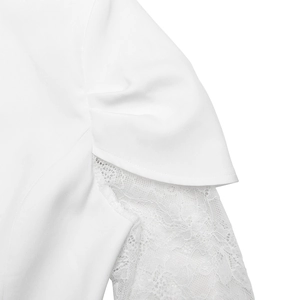 Detail of white blazer shoulder with pleated design and sheer floral lace sleeve textures