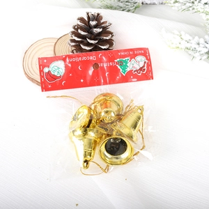 Five gold plastic Christmas bell ornaments with hangers in professional festive packaging