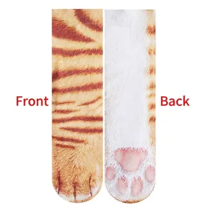 Detailed front and back view of 3D animal paw socks featuring orange tabby cat print