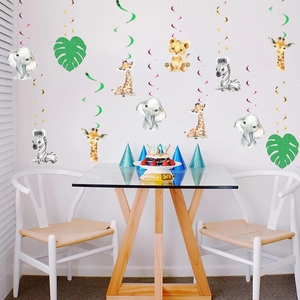 Jungle safari animal swirl decorations with lion and giraffe hanging in a party setting