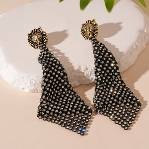 Vintage lion head earrings with sparkling rhinestones and black mesh fringe design