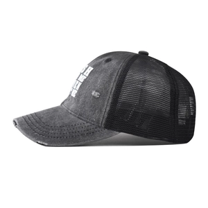 Detailed side view of washed charcoal grey mesh trucker hat with distressed fabric