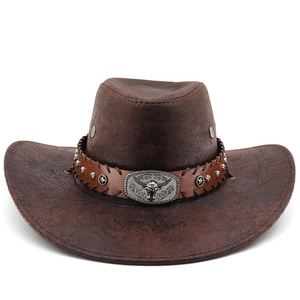 Detail of brown cowboy hat featuring silver bull head buckle and star rivets