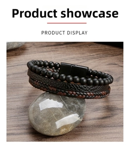 Detail of multi-layer leather bracelet with obsidian beads and black magnetic metal clasp