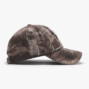 Vintage washed brown cotton baseball cap with distressed details and frayed edges