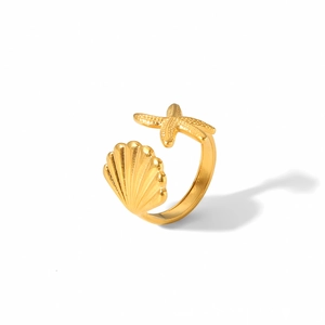 8K gold plated titanium open bracelet with starfish and seashell charms on white background
