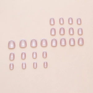 French tip press on nails in soft pearlescent pink and white with a short square shape