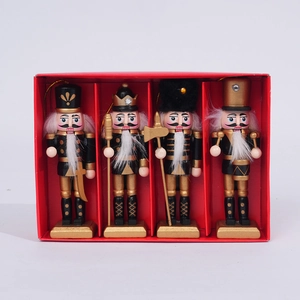 Set of four 12cm wooden Christmas nutcracker soldiers in black and gold gift box