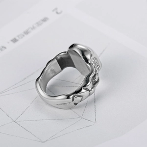 Retro stainless steel skull ring featuring intricate 3D carvings and polished finish