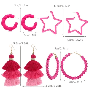 Detailed size view of hot pink tassel, star, and geometric earring set for women