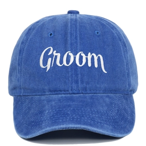 Close-up of white Groom embroidery on navy washed cotton vintage baseball cap