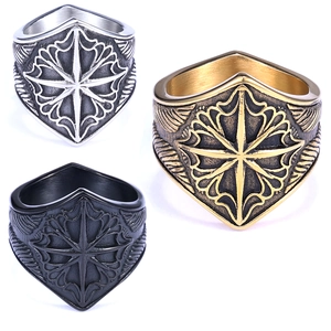 Three men's shield rings in silver, gold and black with retro metal textures