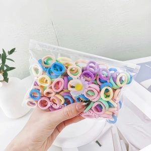 Close-up of assorted macaron colored seamless elastic hair ties in a clear package
