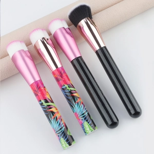Detailed view of heart-shaped foundation brushes with floral patterns and soft bristles