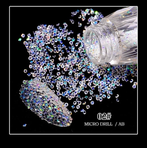 Macro shot of 02# AB crystal micro drill nail art beads in a clear plastic bottle