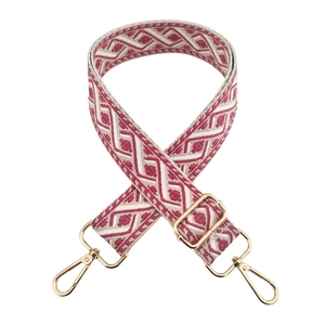Detail of pink and beige geometric jacquard embroidery strap with golden swivel hooks