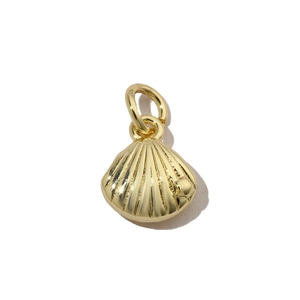 Detailed macro view of a golden shell pendant with polished metallic 3D texture