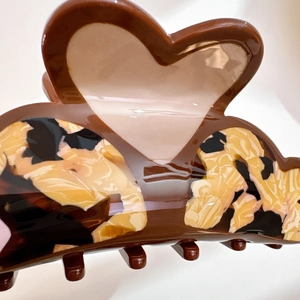 Brown and tortoiseshell acetate heart hair claw clip with glossy finish for women