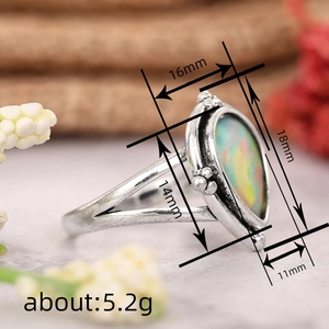 Bague vintage en argent avec opale en forme de goutte et design à double anneau