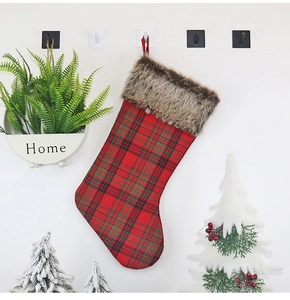 Classic red and green tartan Christmas stocking with plush brown faux fur trim