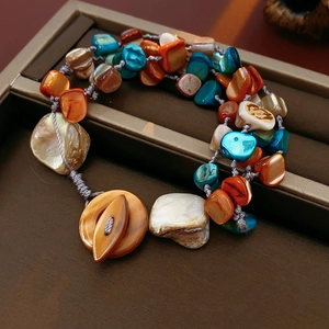 Detailed macro view of bohemian shell bead bracelet on a premium jewelry box background