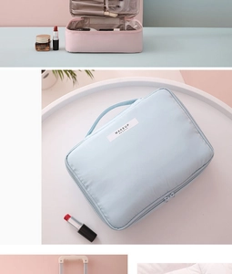 Internal compartments of pink and blue waterproof makeup bags with brush holders